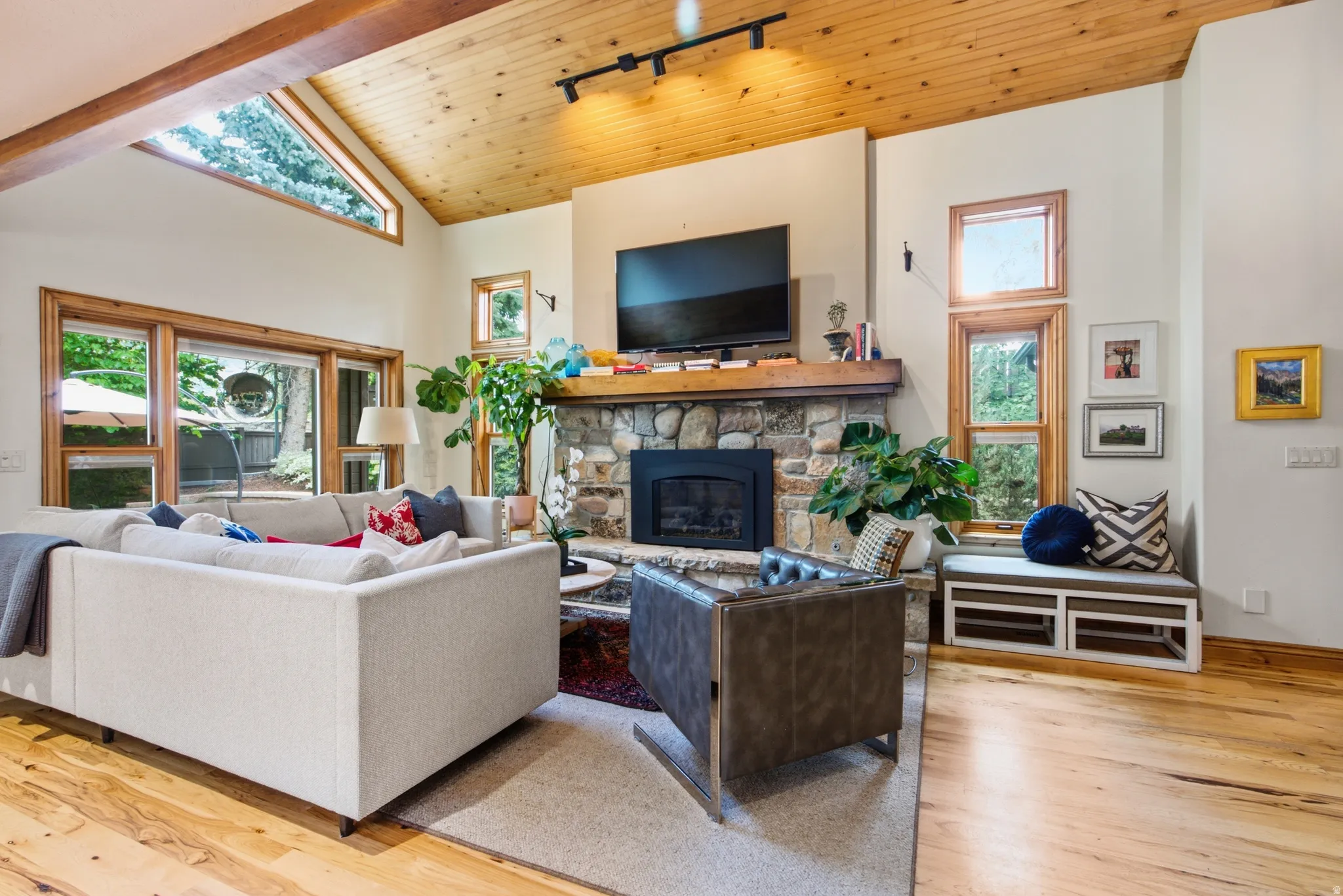 Vaulted wood-paneled ceiling with exposed wood beams