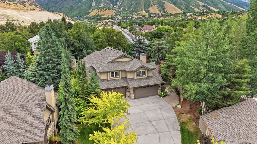 Two-story residence with a multi-gabled roofline and attached two-car garage