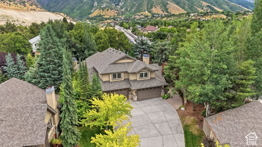 Two-story residence with a multi-gabled roofline and attached two-car garage
