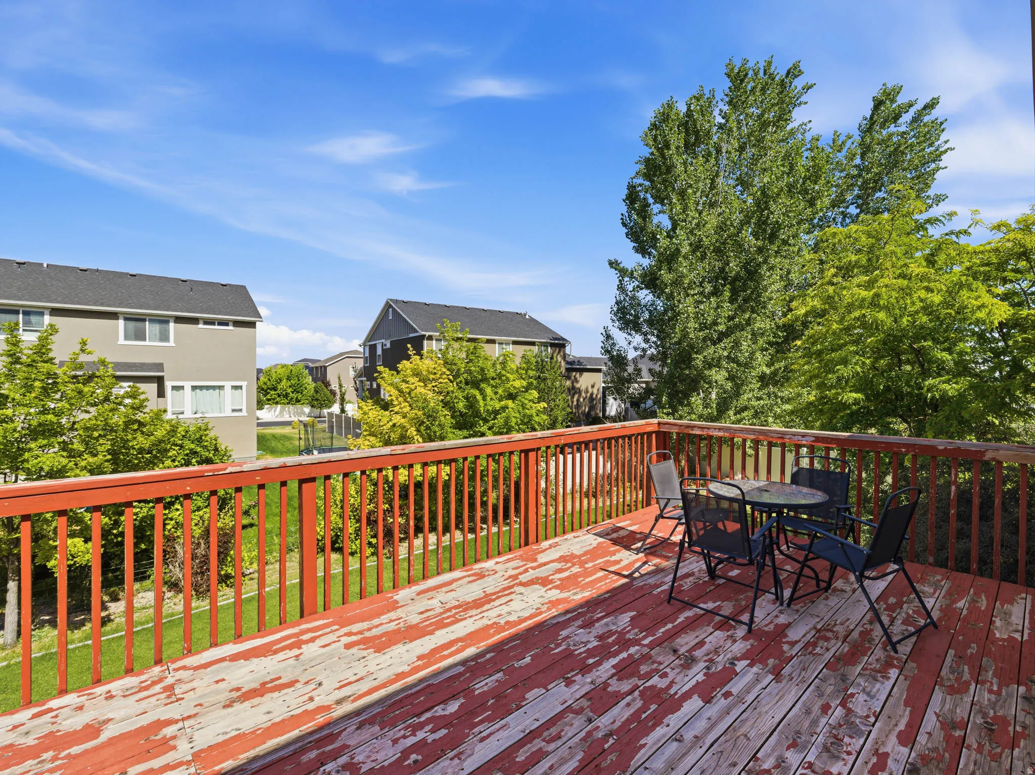 Expansive outdoor deck with wooden railing