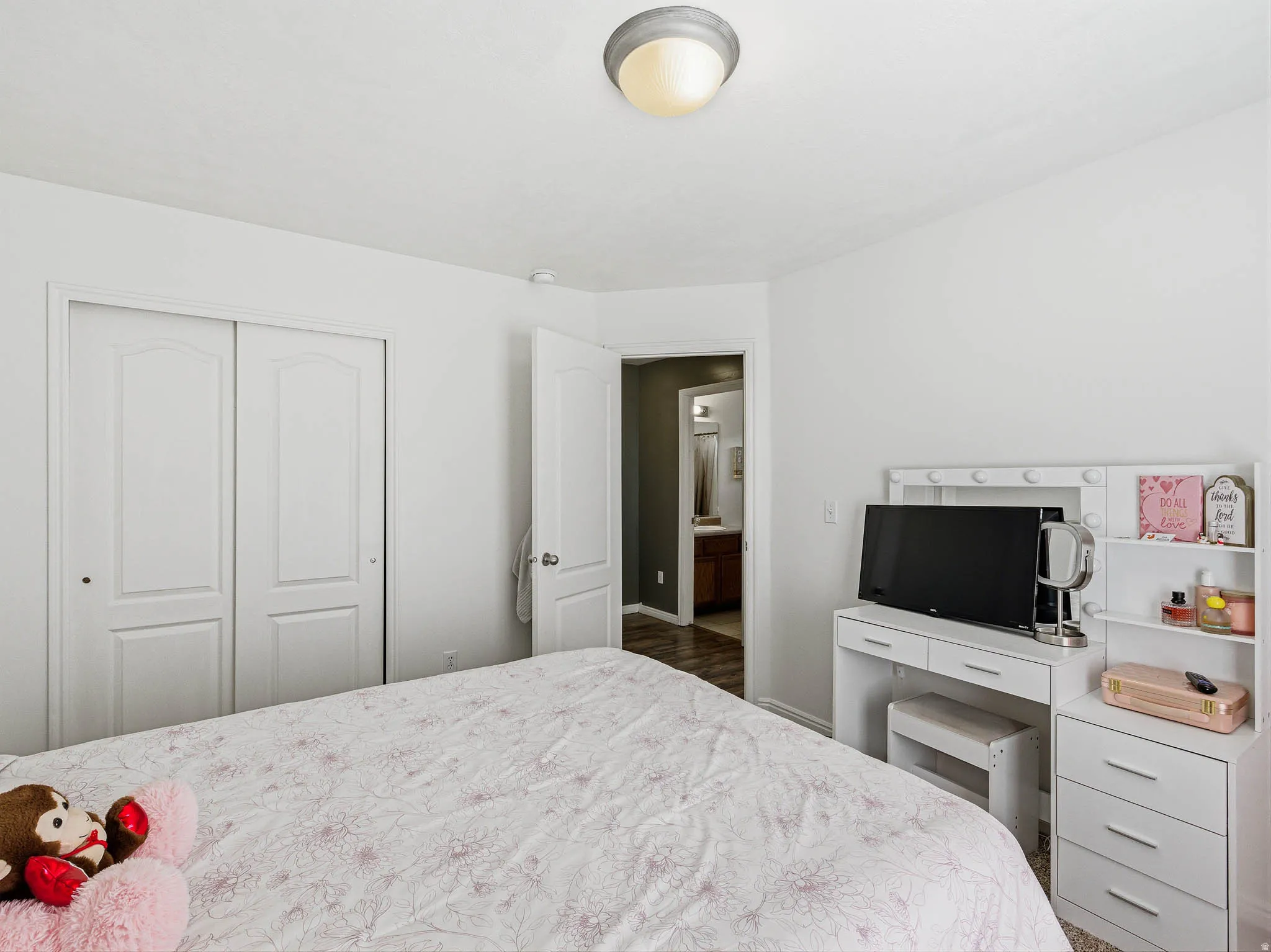 Bedroom featuring light-colored walls and a semi-flush mount ceiling fixture