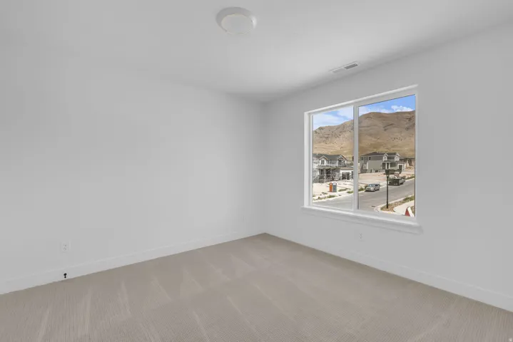 Generous bedroom with views of the east mountains.