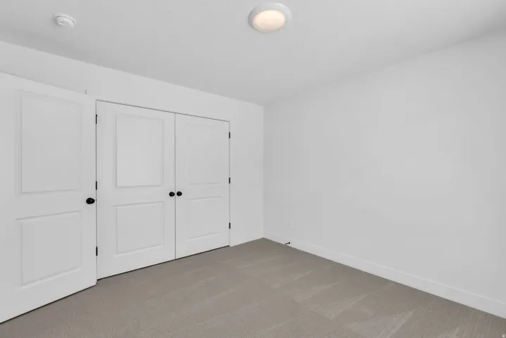 Bedroom with large two door closet.