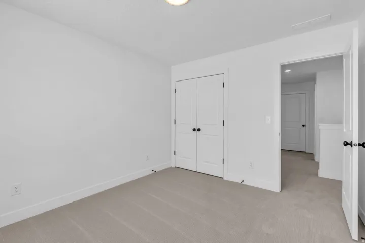 Bedroom with large two door closet.