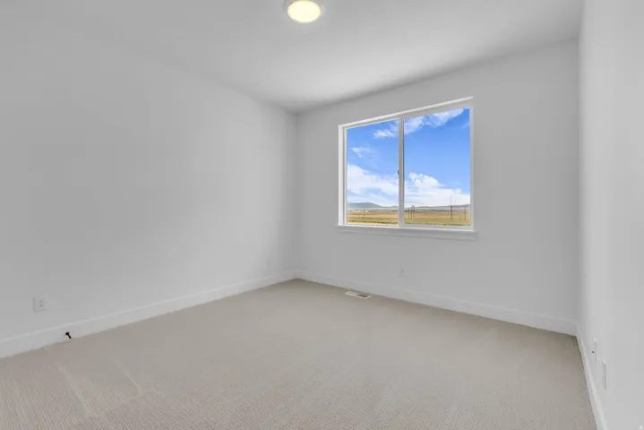Main floor guest suite with full bath attached.  This room boasts beautiful views of the mountain.