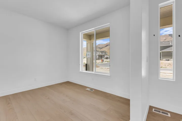 Large front flex space with an oversized window looking out to the beautiful mountain views to the east.