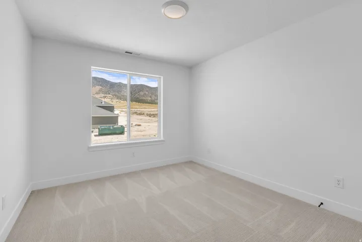 Generous bedroom with mountain view.