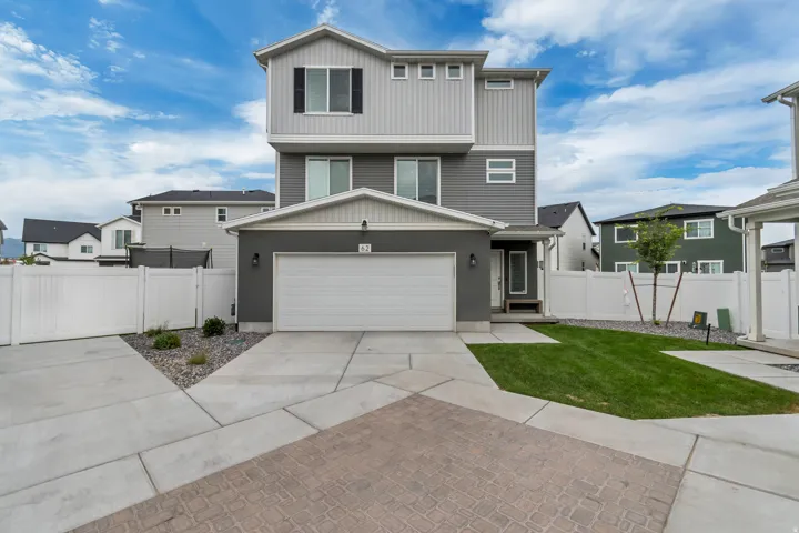 Modern multi-level exterior featuring dark gray and light gray siding