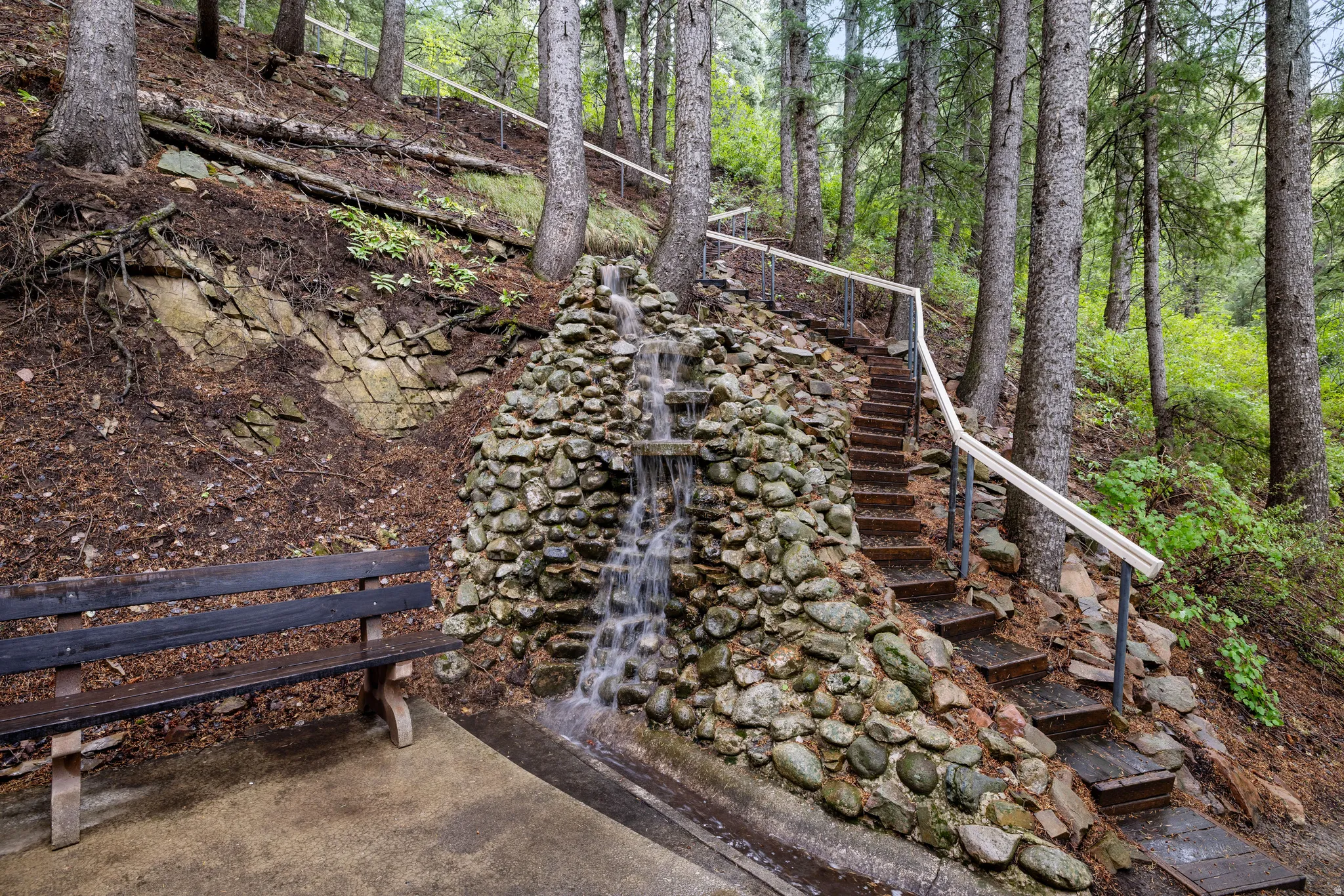 Stone waterfall with stairs that lead to Lovers Ln.