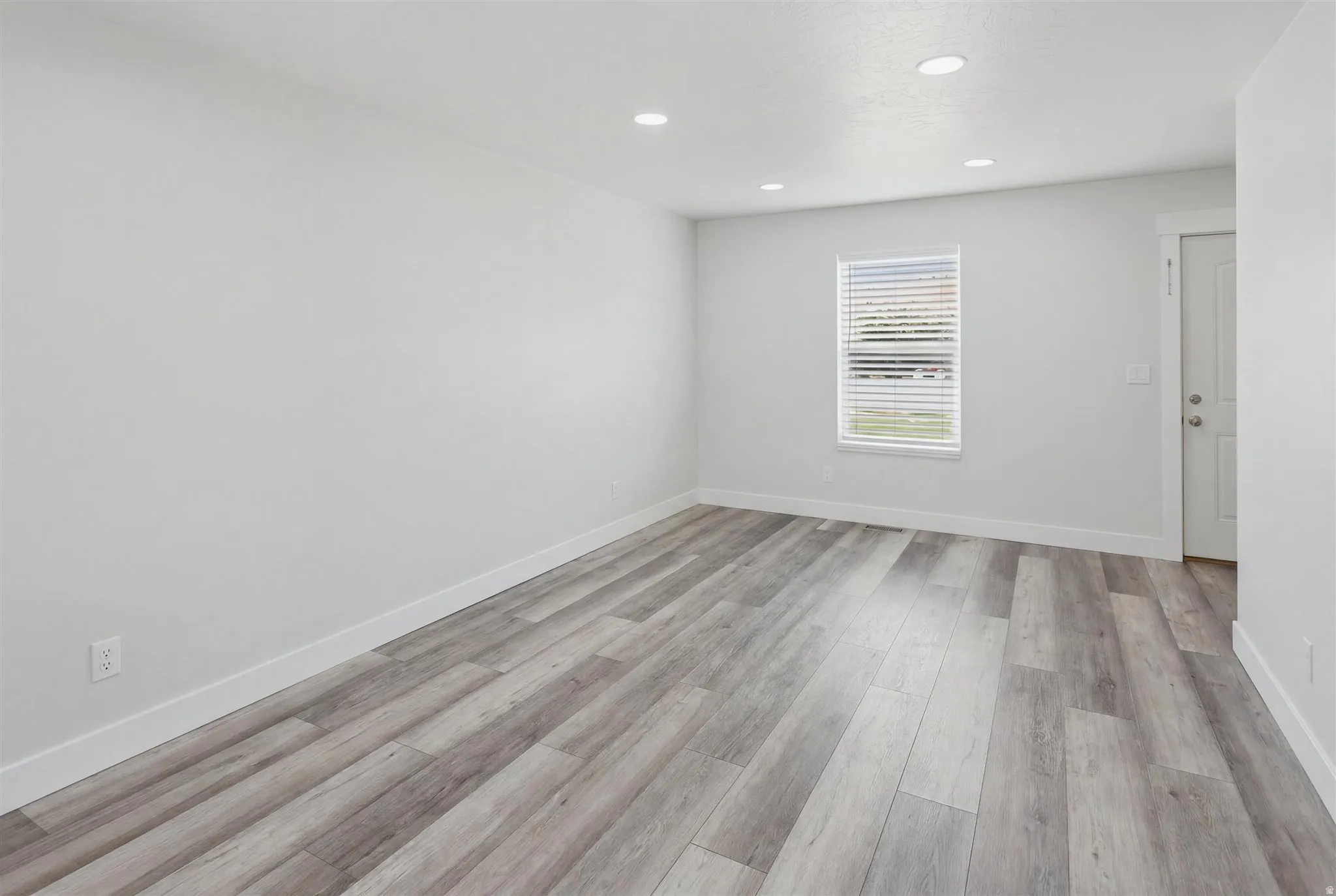 Bright interior space featuring light wood-finish flooring