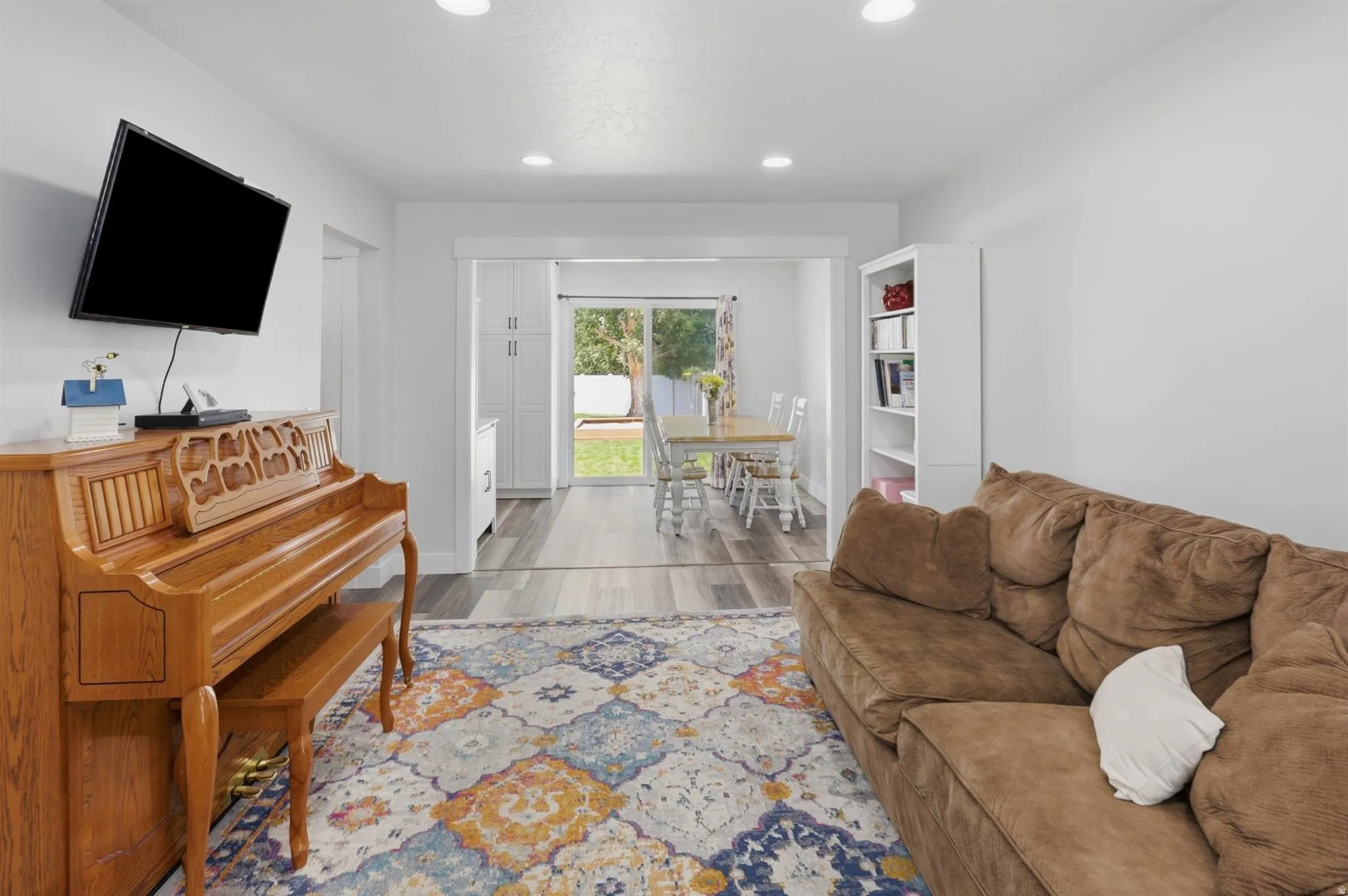 Recessed lighting illuminates this open-concept living area