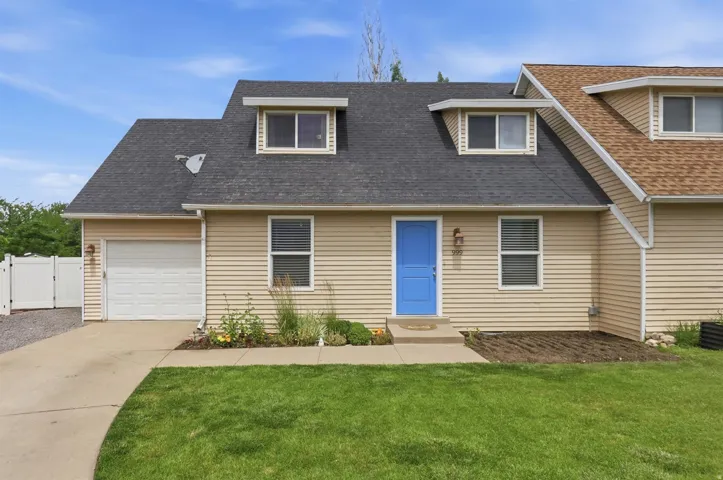 Beige horizontal siding exterior with a contrasting blue entry door