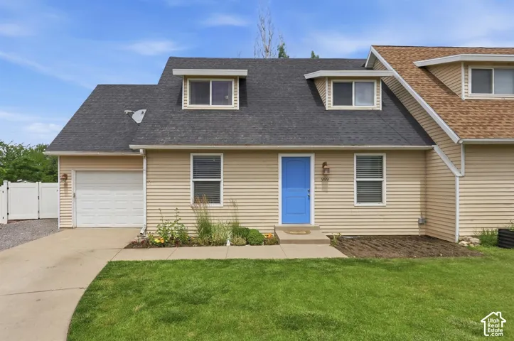 Beige horizontal siding exterior with a contrasting blue entry door