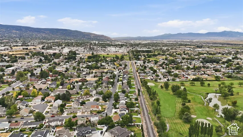 Aerial perspective showcasing trail running between a residential area and golf course.