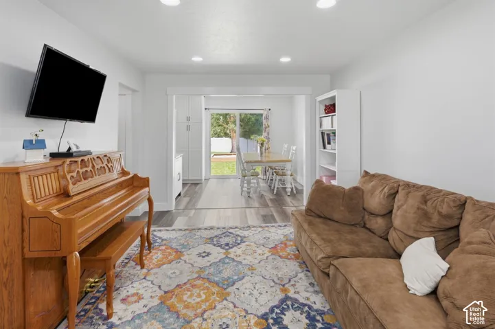 Recessed lighting illuminates this open-concept living area