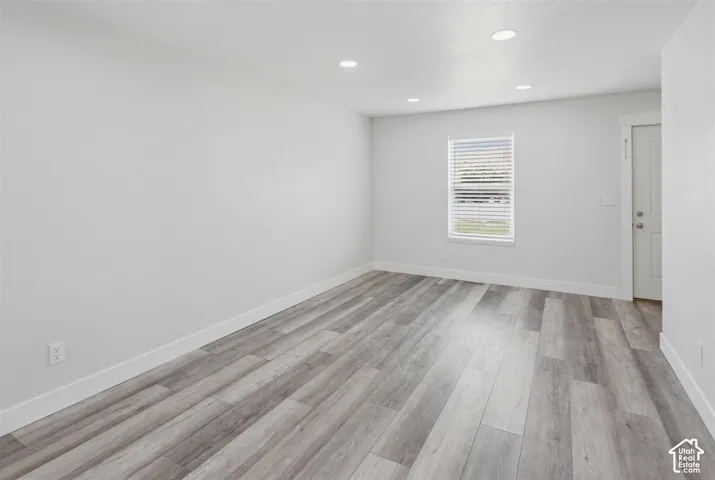 Bright interior space featuring light wood-finish flooring