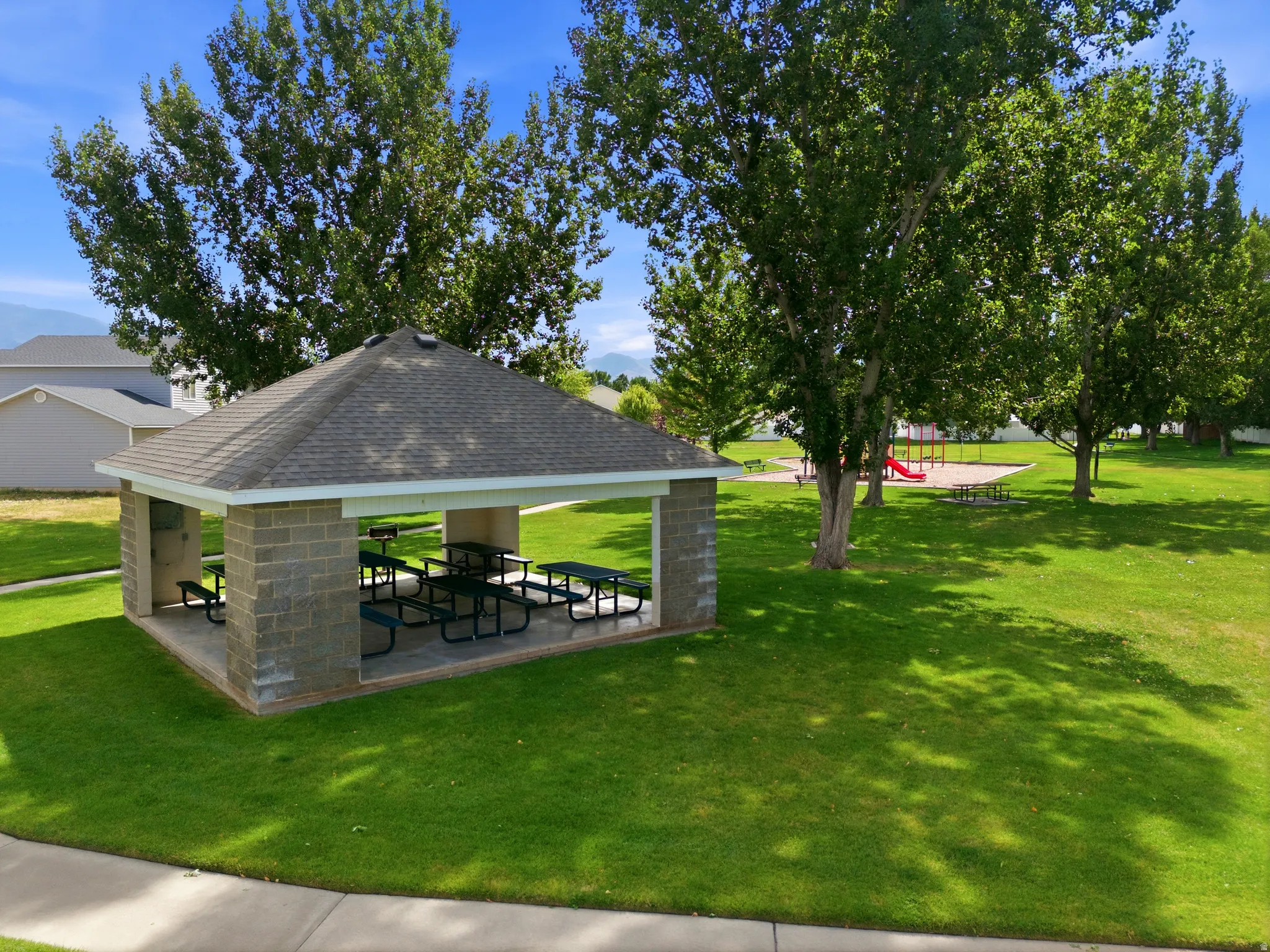 Community pavilion featuring a shingled roof and block construction