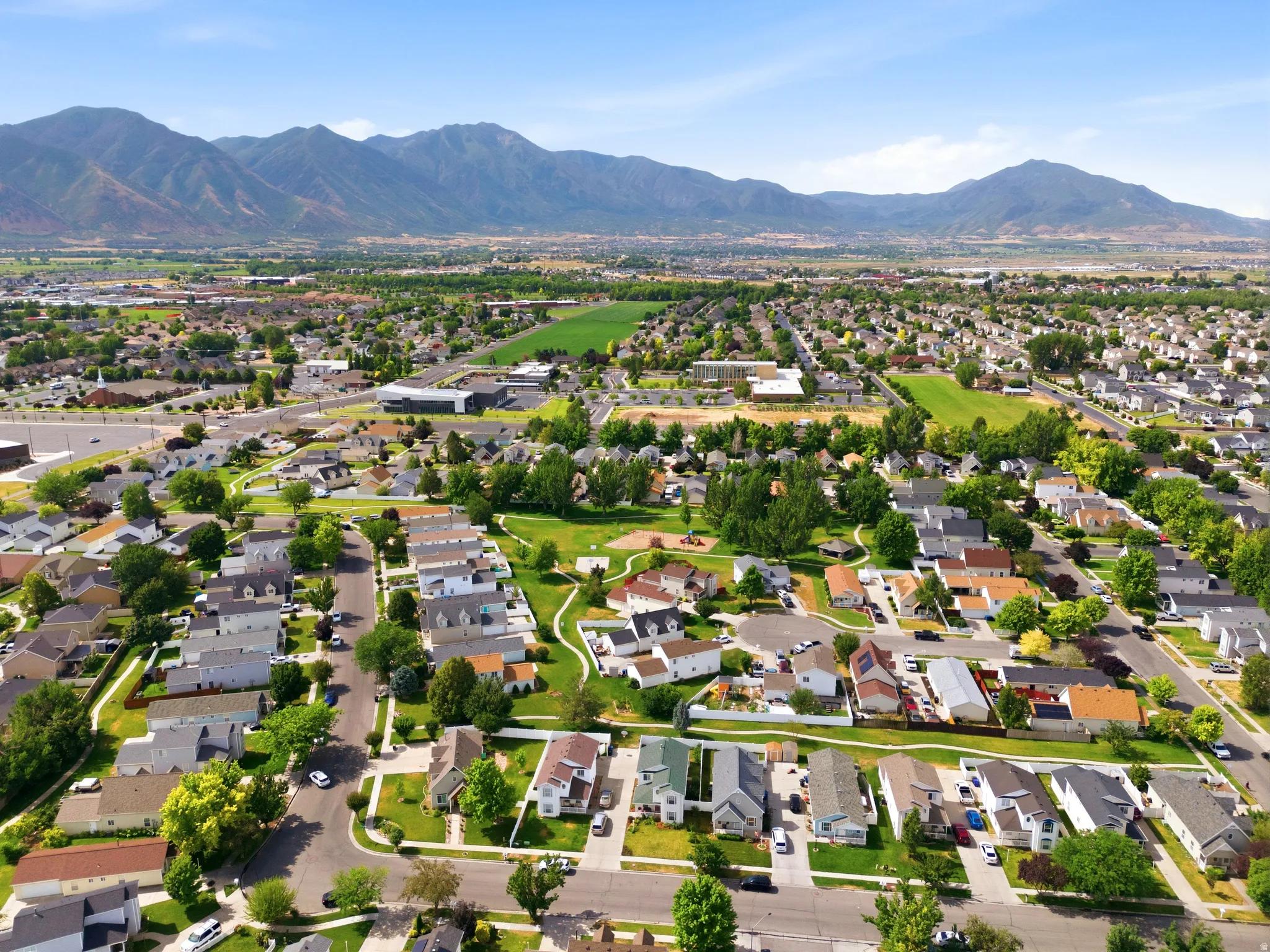 Expansive residential area featuring a diverse collection of single-family homes, mature landscaping, and tree-lined streets