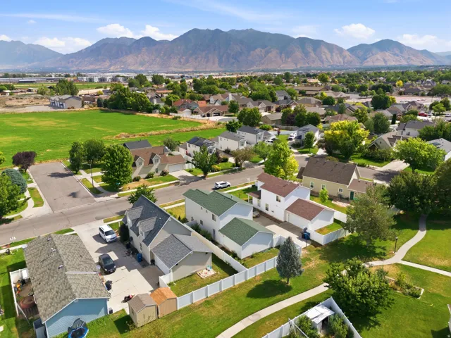 Aerial perspective highlighting a residential community with distant mountain ranges