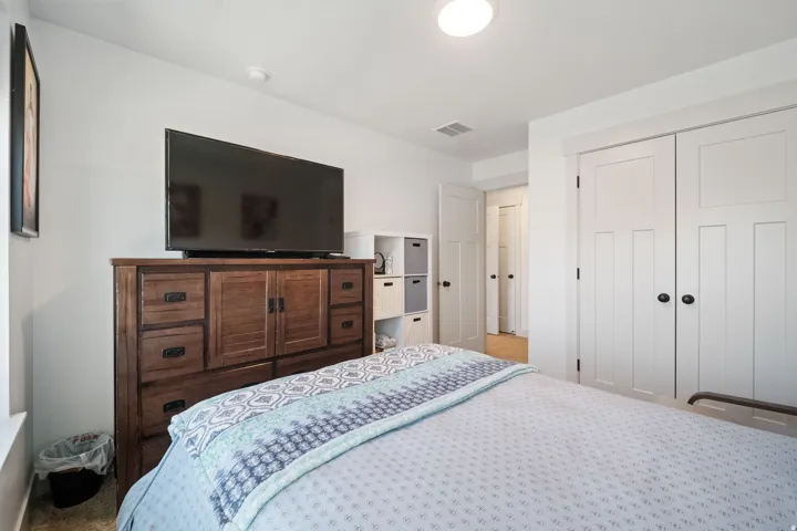 Room featuring light-toned walls, white trim, and a flush-mount ceiling light