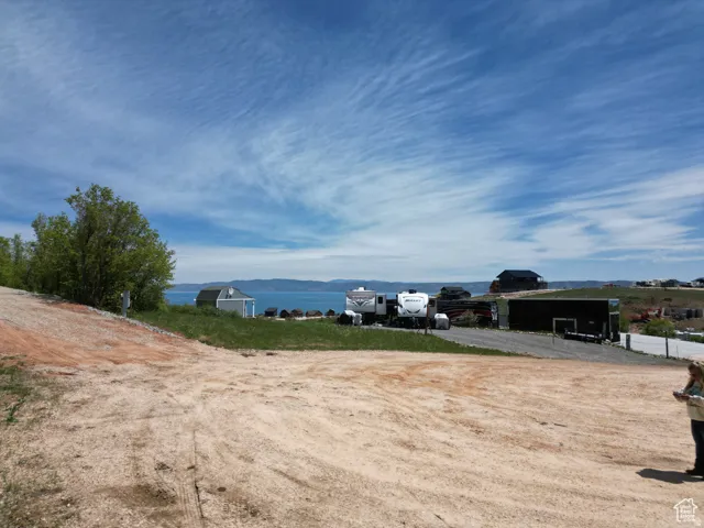 View of yard with a mountain view and an outdoor structure