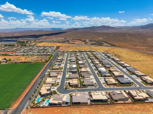 Aerial perspective showcasing a developed residential community with numerous single-story homes