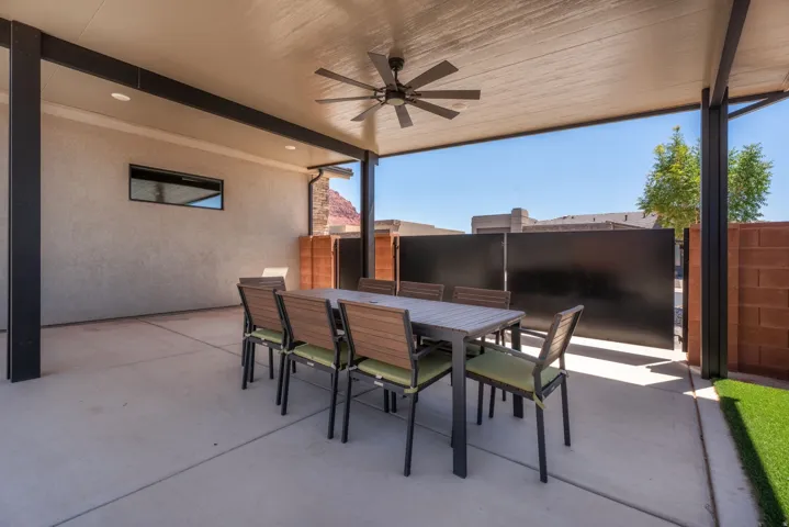 Covered patio with a ceiling fan, recessed lighting, and a stucco exterior wall
