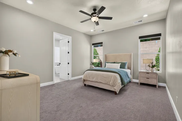Carpeted room with recessed lighting and a ceiling fan