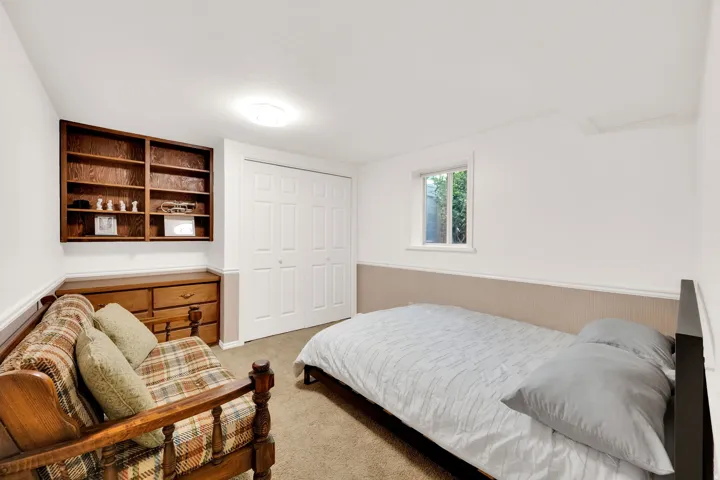 Recessed window and light-toned walls with wainscoting