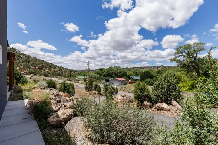 Expansive landscape featuring rolling hills and abundant natural vegetation