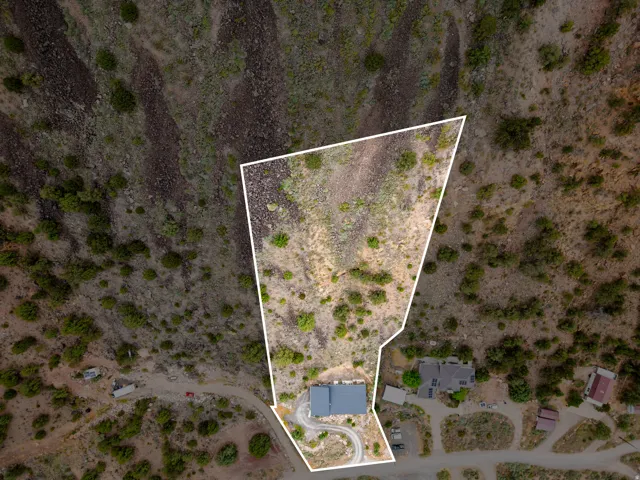 Expansive natural terrain lot with varied topography and established vegetation