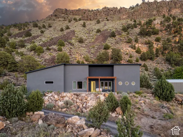 Modern dwelling with a flat roofline and dark gray exterior