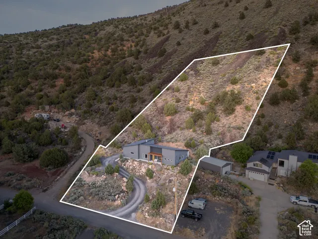 Modern-style residence featuring a sloped roofline and a neutral exterior color palette