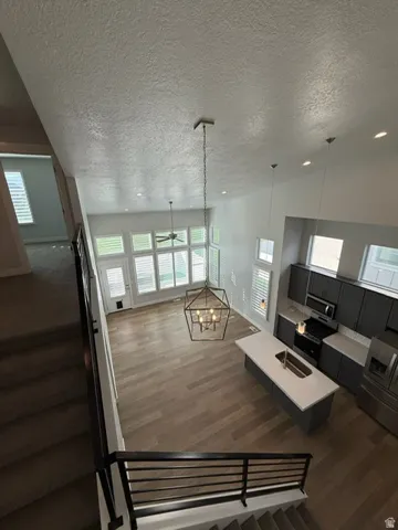 Two-story living area with wood-finish flooring