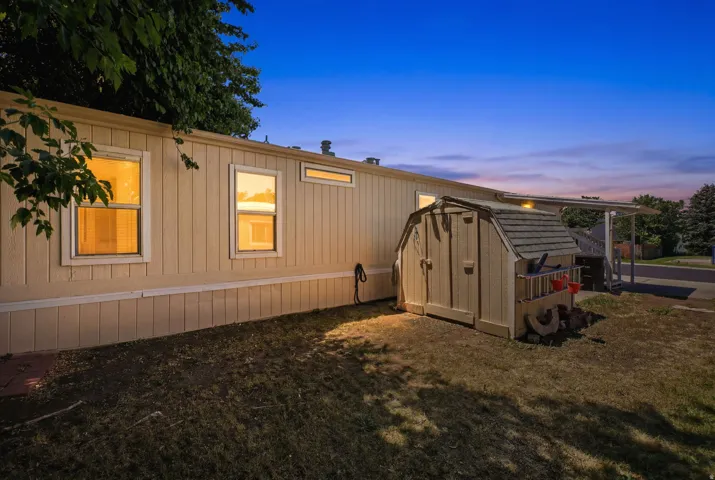Exterior siding with multiple windows providing natural light