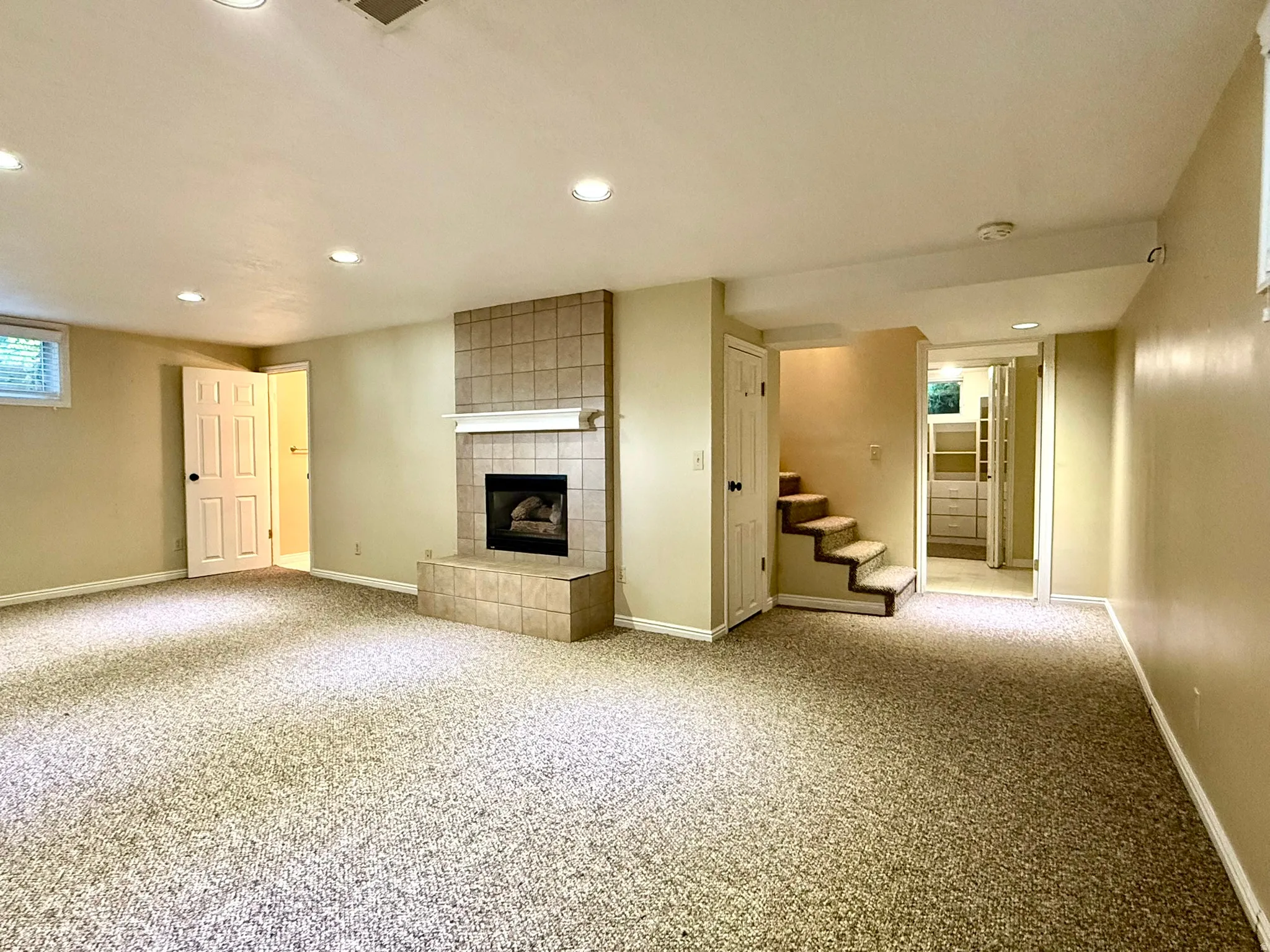 LL TV Room, Play Room or an Extra Guest Bedroom with it's own bathroom  fireplace with mantel, recessed lighting, and a window