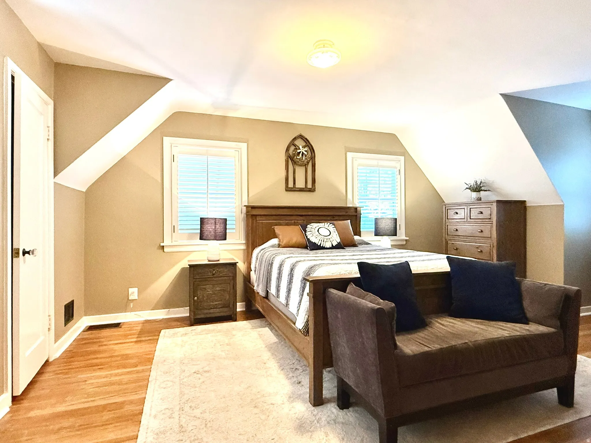Primary Bedroom, with  Hardwood flooring