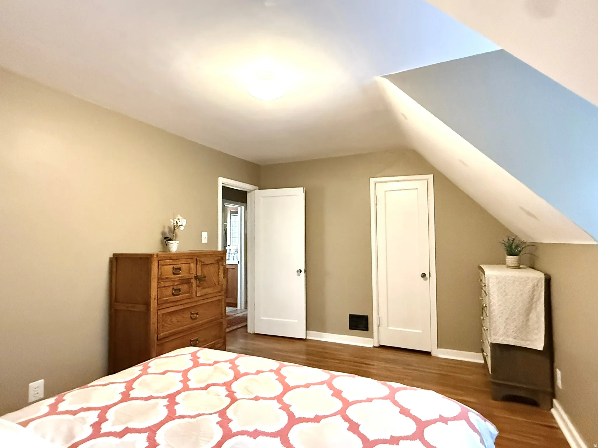 Bedroom #2 featuring hardwood flooring and a neutral wall color