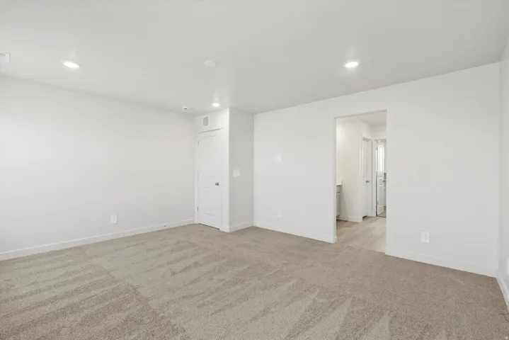 **DISCLAIMER** Interior package may vary. Spacious room featuring neutral carpeting and white painted walls