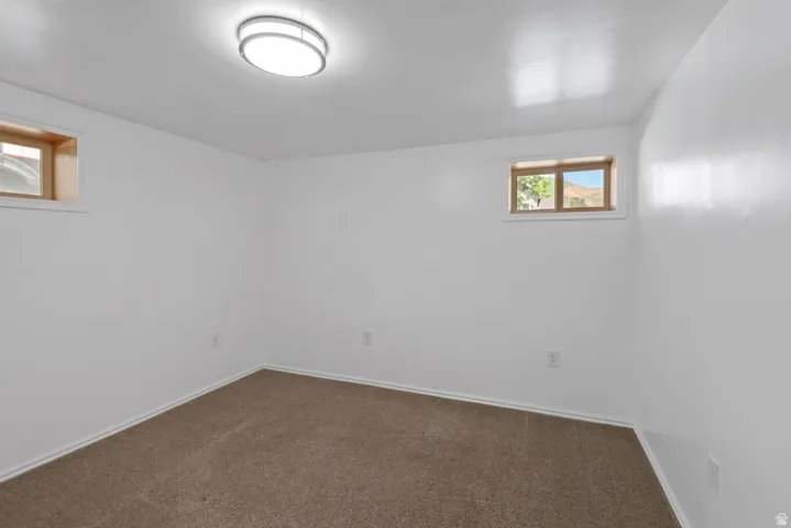 Bedroom with freshly cleaned carpet and fresh paint, new windows
