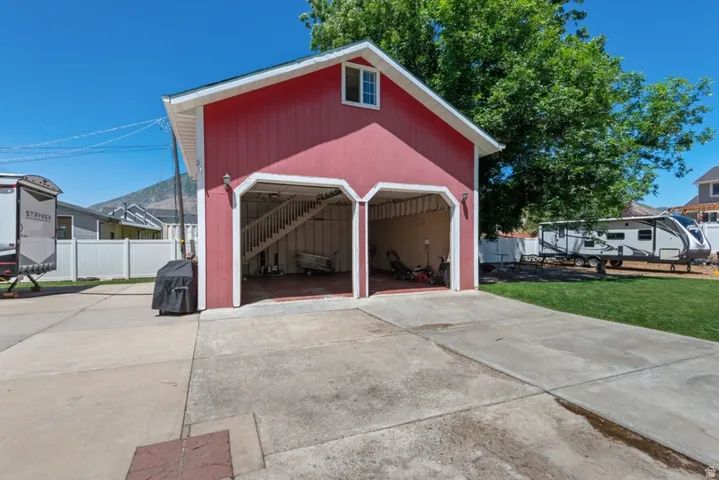 Detached 25x25 two car detached garage with loft upstairs. Over size ceilings and insulated garage doors.