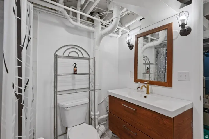 Bathroom featuring a wood-finish vanity