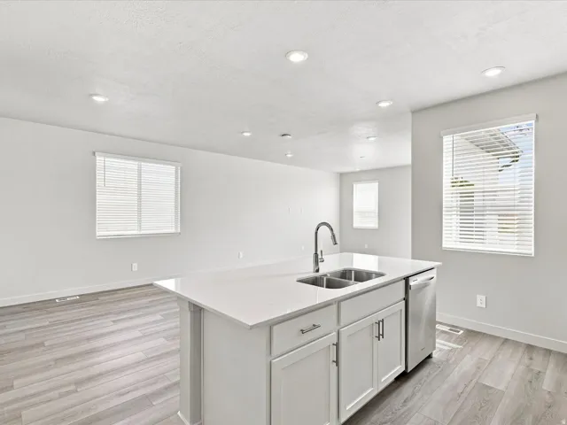 Kitchen island with dual stainless steel sink and gooseneck faucet
