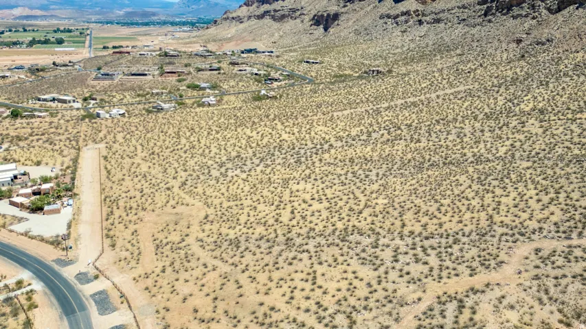 Expansive desert landscape with scattered low-lying vegetation