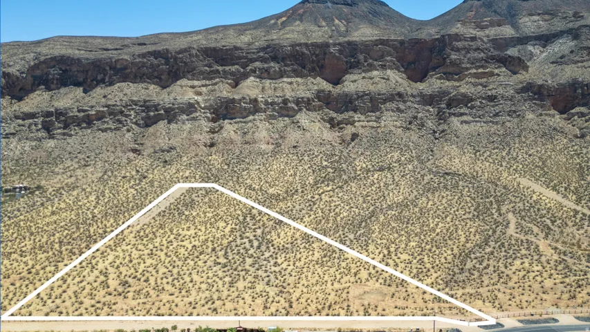 Expansive desert landscape with a mountainous backdrop