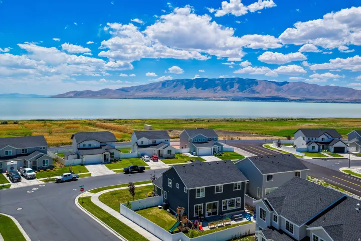 Residential neighborhood featuring modern homes, paved streets, and landscaped yards