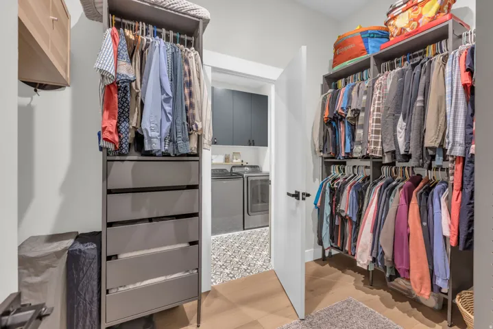 Walk-in closet with integrated shelving and drawer storage