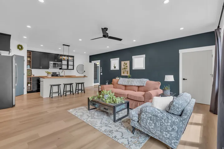 Open-concept living area featuring light wood-finish flooring throughout
