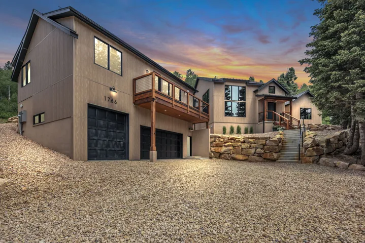 Modern architectural design featuring vertical siding and stucco finishes