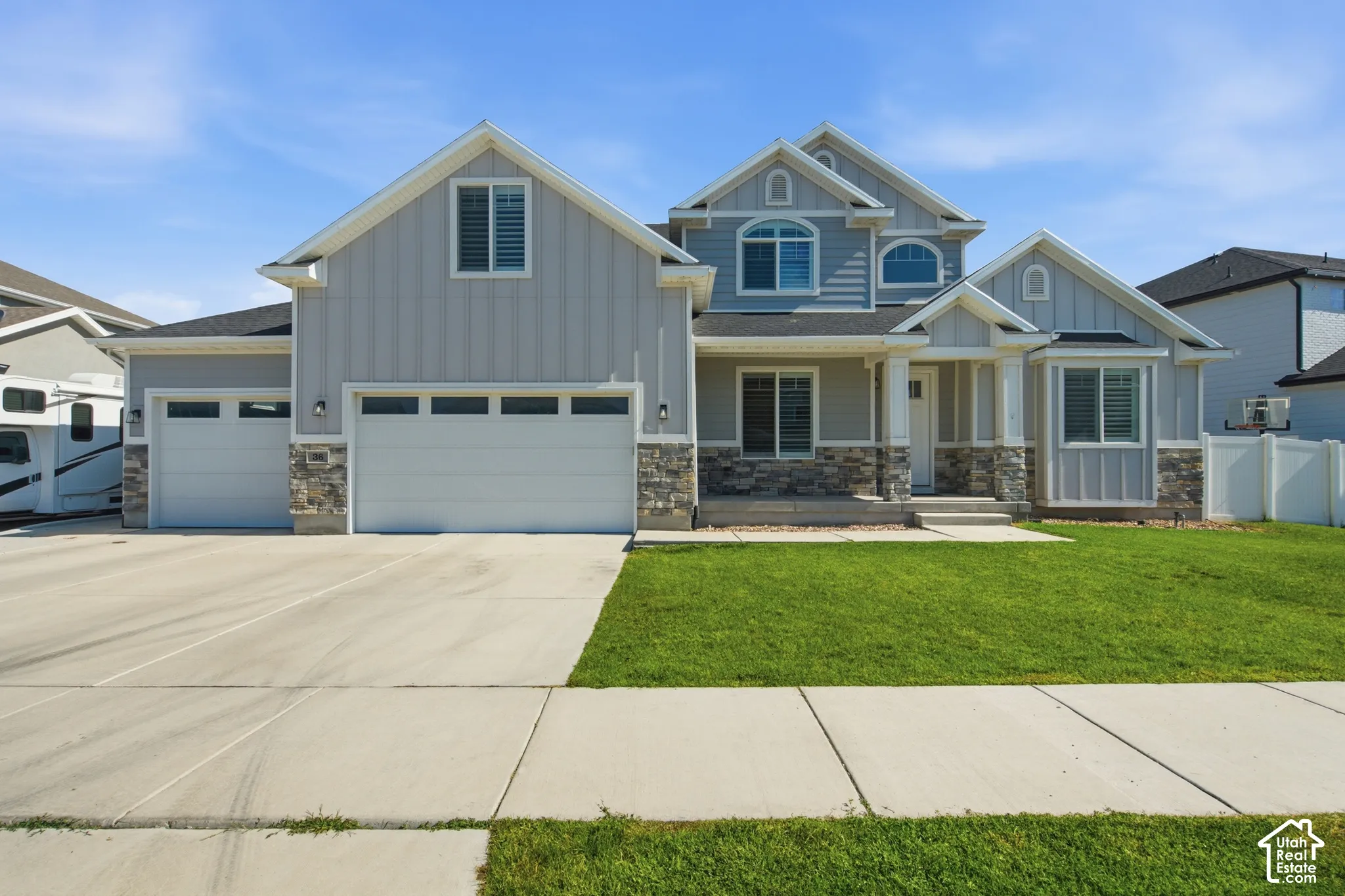 Light grey siding exterior with stone accents